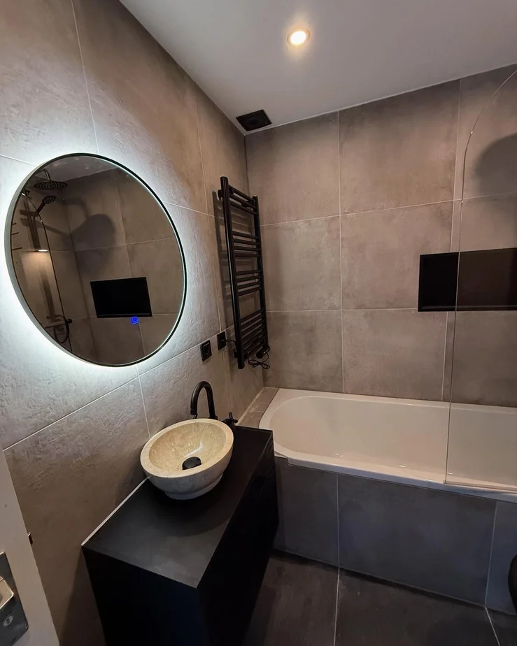 Modern Bathroom Renovation with Black Fixtures & Built-In Niches